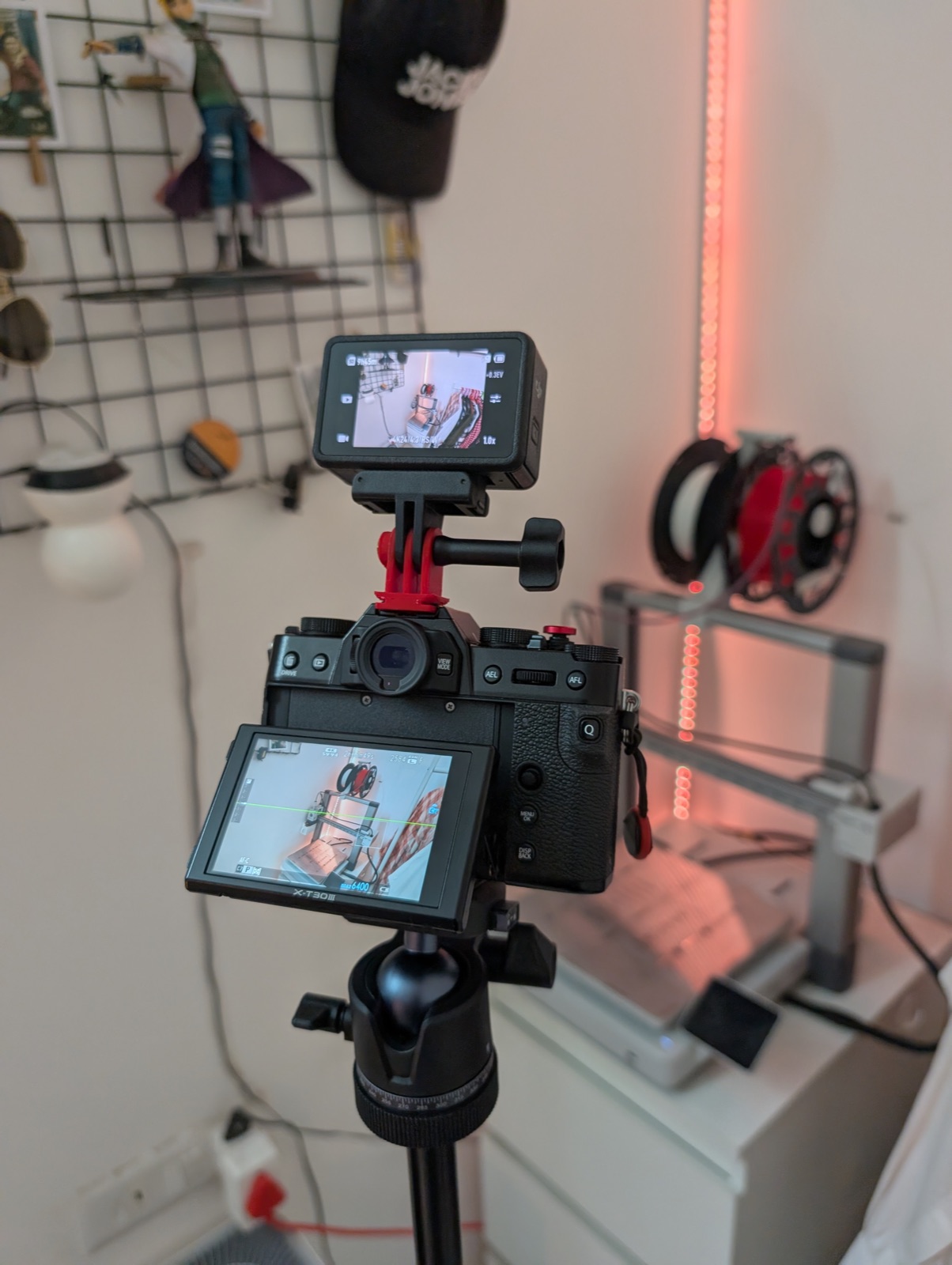 The full rig mounted on the travel tripod, both cameras framed up, spool of filament visible in the background